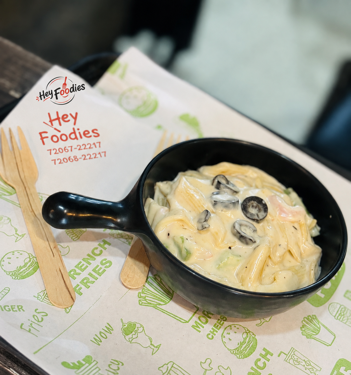 Creamy white sauce pasta served at Hey Foodies